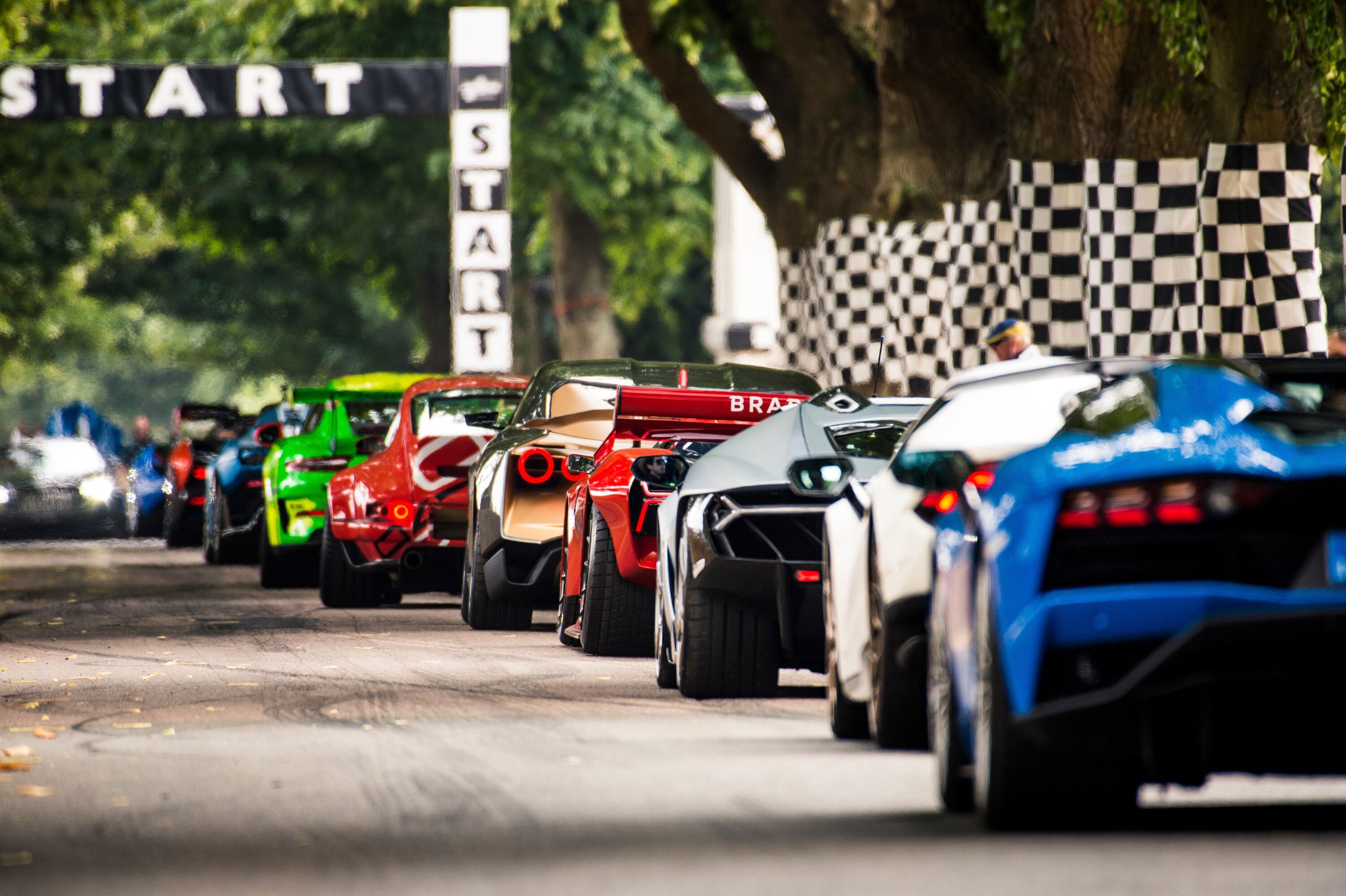 ***FREE TO USE***Supercars wait to do their run up the Hillclimb at the Goodwood Festival of Speed