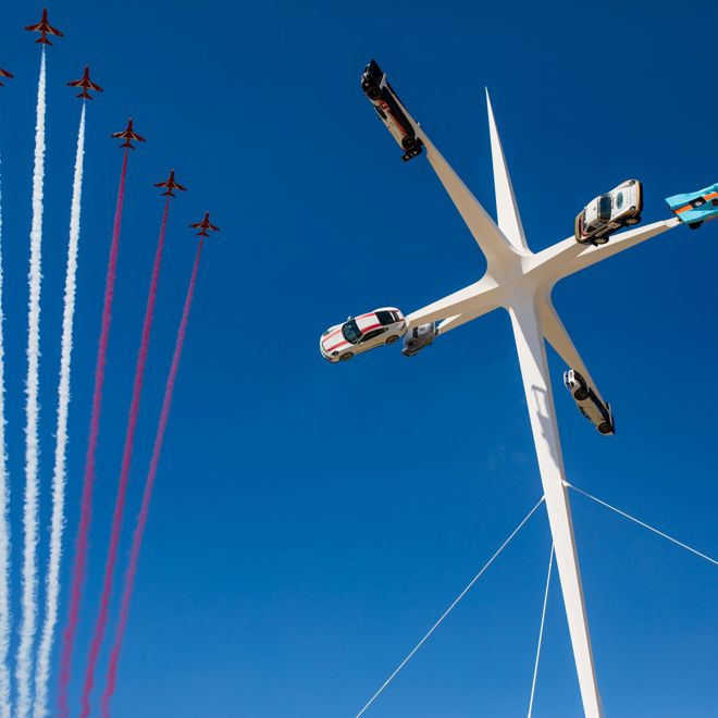 The Red Arrows performing at the 2018 Goodwood Festival of Speed in West Sussex 15/07/2018. The Royal Air Force Aerobatic Team flew directly above the Central Feature, the ultimate expression of design, engineering and speed and epitomises both the event and its celebrated marque, Porsche. The creation of British artist and designer Gerry Judah, who has been masterminding the Central Features at the Festival of Speed for 21 years, the sculpture stands impressively in front of Goodwood House and at 52m high, towers above the entire event..For all editorial enquiries, please contact Laura Gilbert-Burke at the Goodwood Motor Sport Press Office 01243 755000 or Alex Benwell: 07976 236469..Please credit: Nicole Hains