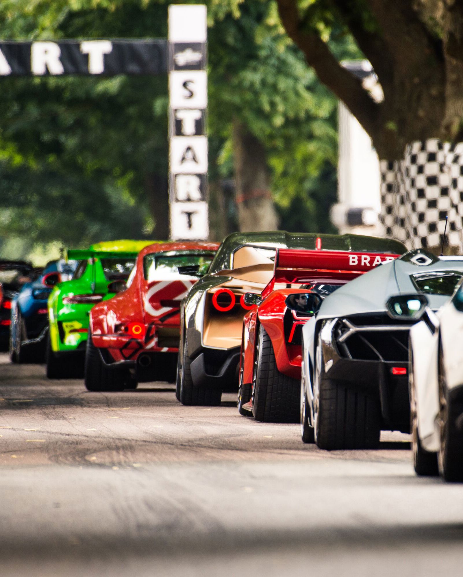 ***FREE TO USE***Supercars wait to do their run up the Hillclimb at the Goodwood Festival of Speed
