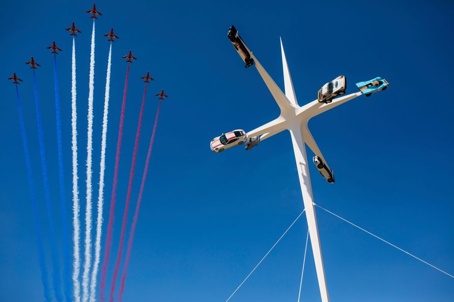 The Red Arrows performing at the 2018 Goodwood Festival of Speed in West Sussex 15/07/2018. The Royal Air Force Aerobatic Team flew directly above the Central Feature, the ultimate expression of design, engineering and speed and epitomises both the event and its celebrated marque, Porsche. The creation of British artist and designer Gerry Judah, who has been masterminding the Central Features at the Festival of Speed for 21 years, the sculpture stands impressively in front of Goodwood House and at 52m high, towers above the entire event..For all editorial enquiries, please contact Laura Gilbert-Burke at the Goodwood Motor Sport Press Office 01243 755000 or Alex Benwell: 07976 236469..Please credit: Nicole Hains