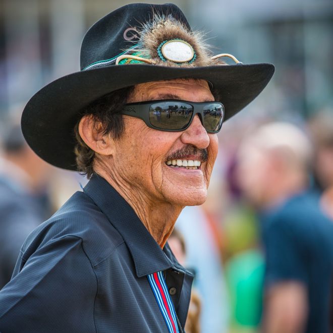Richard Lee Petty, nicknamed The King, is a former NASCAR driver who raced in the Strictly Stock/Grand National Era and the NASCAR Winston Cup Series.  Wearing his trademark Stetson hat.