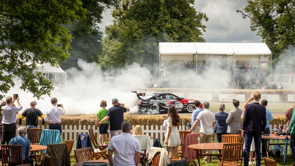 GRRC members watch the driftkhana from their Kinrara Enclosure at the first bend of the hill at Goodwood Festival of Speed..Picture date: Sunday July 11, 2021..Photograph by Christopher Ison ©.07544044177.chris@christopherison.com.www.christopherison.com..IMPORTANT NOTE REGARDING IMAGE LICENCING FOR THIS PHOTOGRAPH: This image is supplied to the client under the terms previously agree. No sales are permitted unless expressly agreed in writing by the photographer.