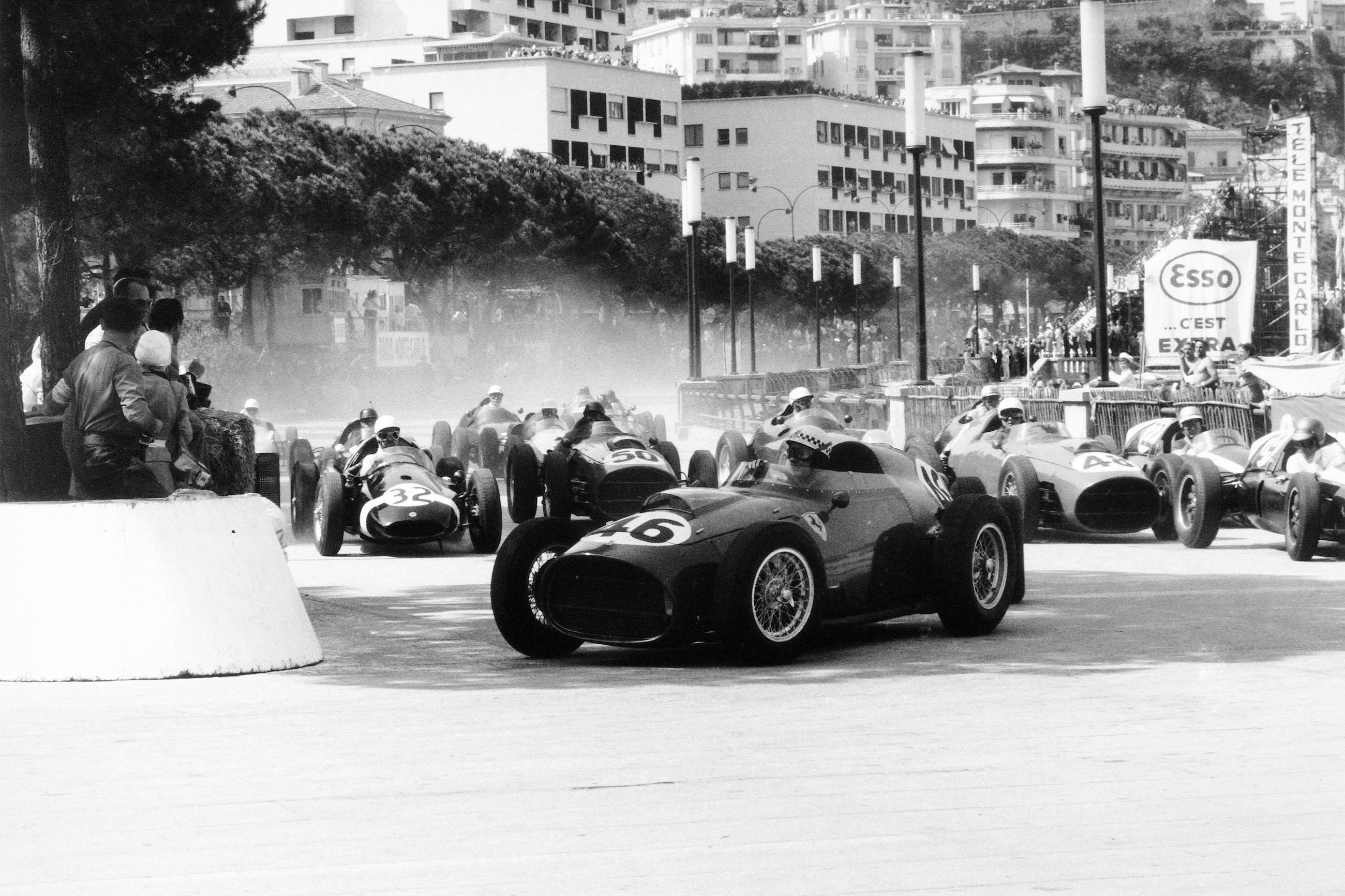 Monaco, 1959. Jean Behra in his Ferrari Dino 246 leads Stirling Moss and Jack Brabham in their Cooper T51 Climax.