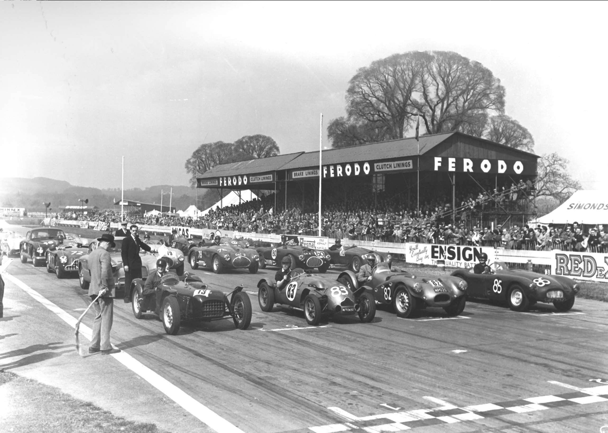 Typical Goodwood special sports car handicap, 1954 Easter Monday  - Mike Anthony (Lotus 6), Brian Naylor (Cooper-MG), Gerry Ruddock (Lester-MG) and Dick Steed (JAG-MG) flagged away from the front row.