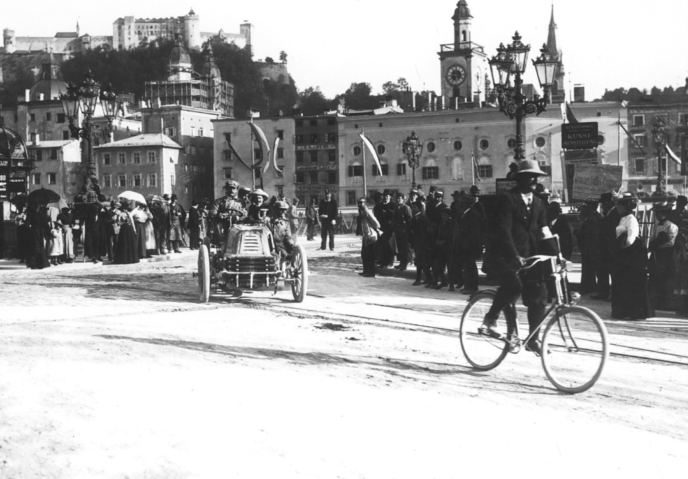 1902 Paris-Venna - cycling paceman leads a competing car through the neutralised section of the race through the city of Salzburg.  The timing system proved wide open to abuse...