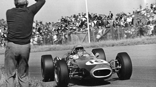 Jack Brabham typically enjoying himself in the manouevrable Repco Brabham BT19 - winning the 1966 Dutch GP.