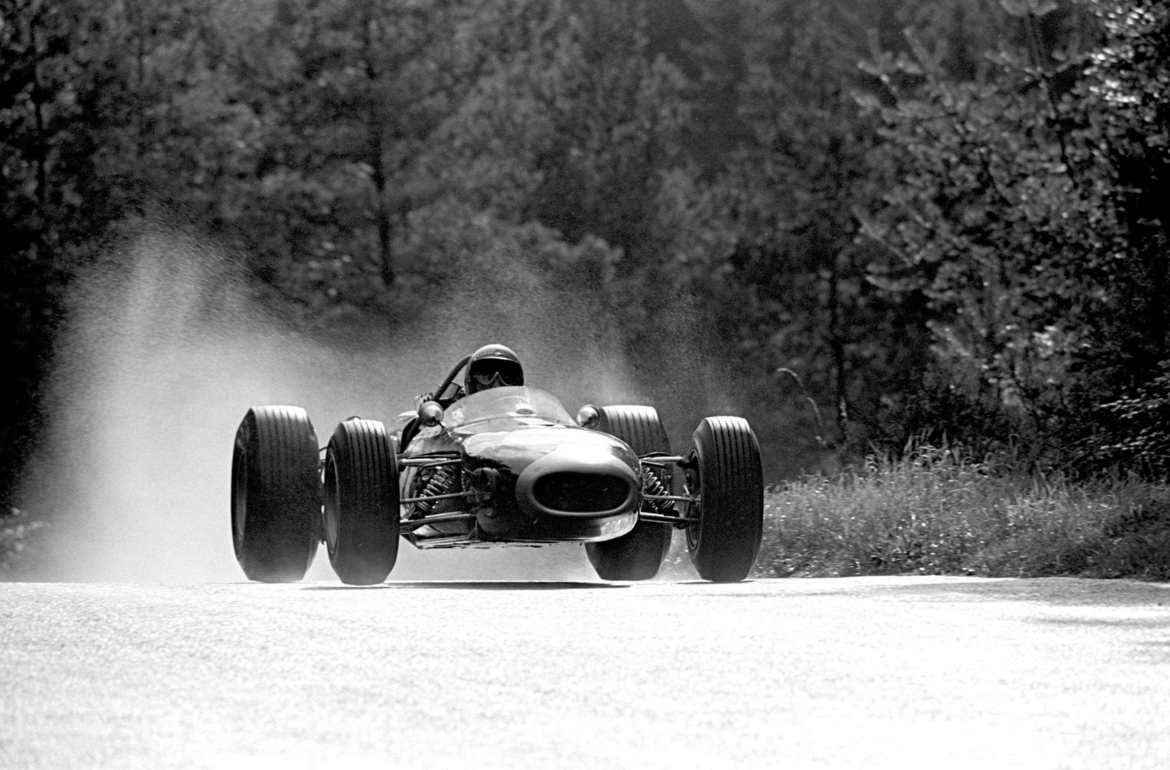 Sun shining on Jack Brabham as his Repco Brabham BT19 carries him towards 1966 German GP victory.