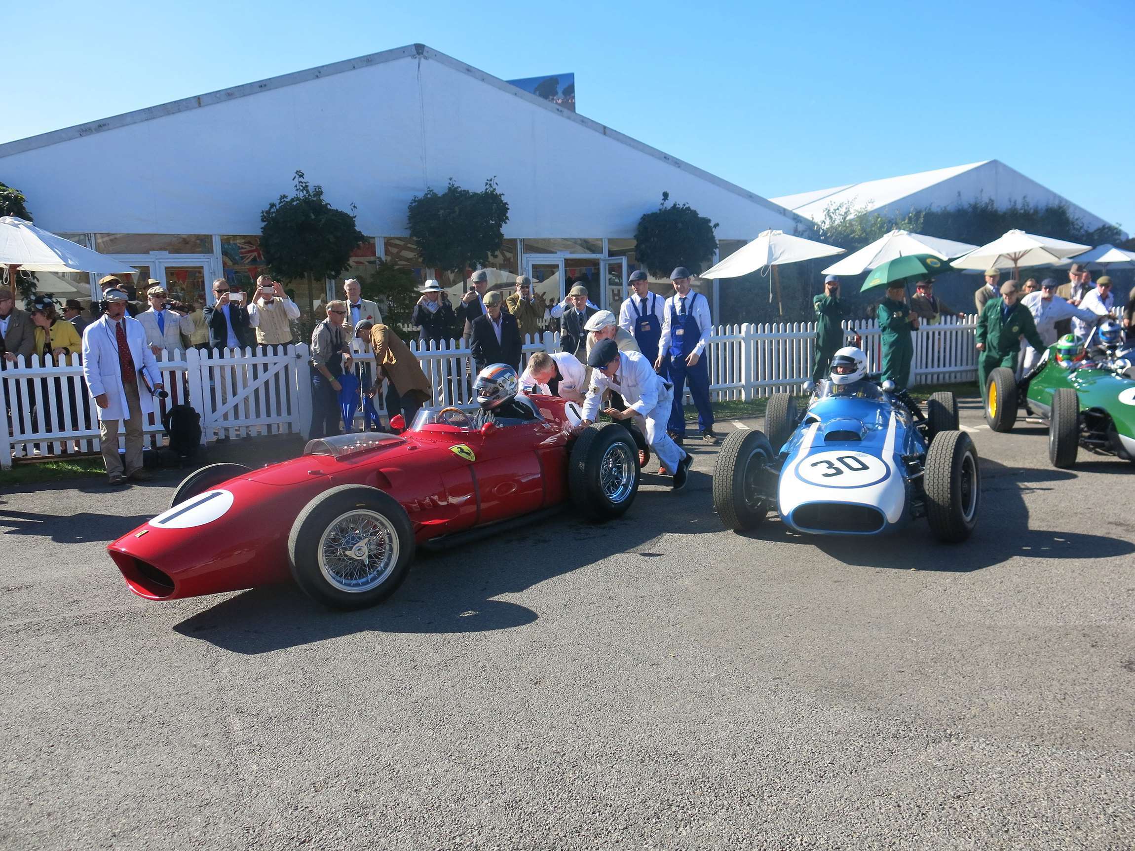 Revival 2016 - Rob Hall in the 1960 Ferrari Dino 246 flanked by race-winning Julian Bronson Scarab-Offenhauser.