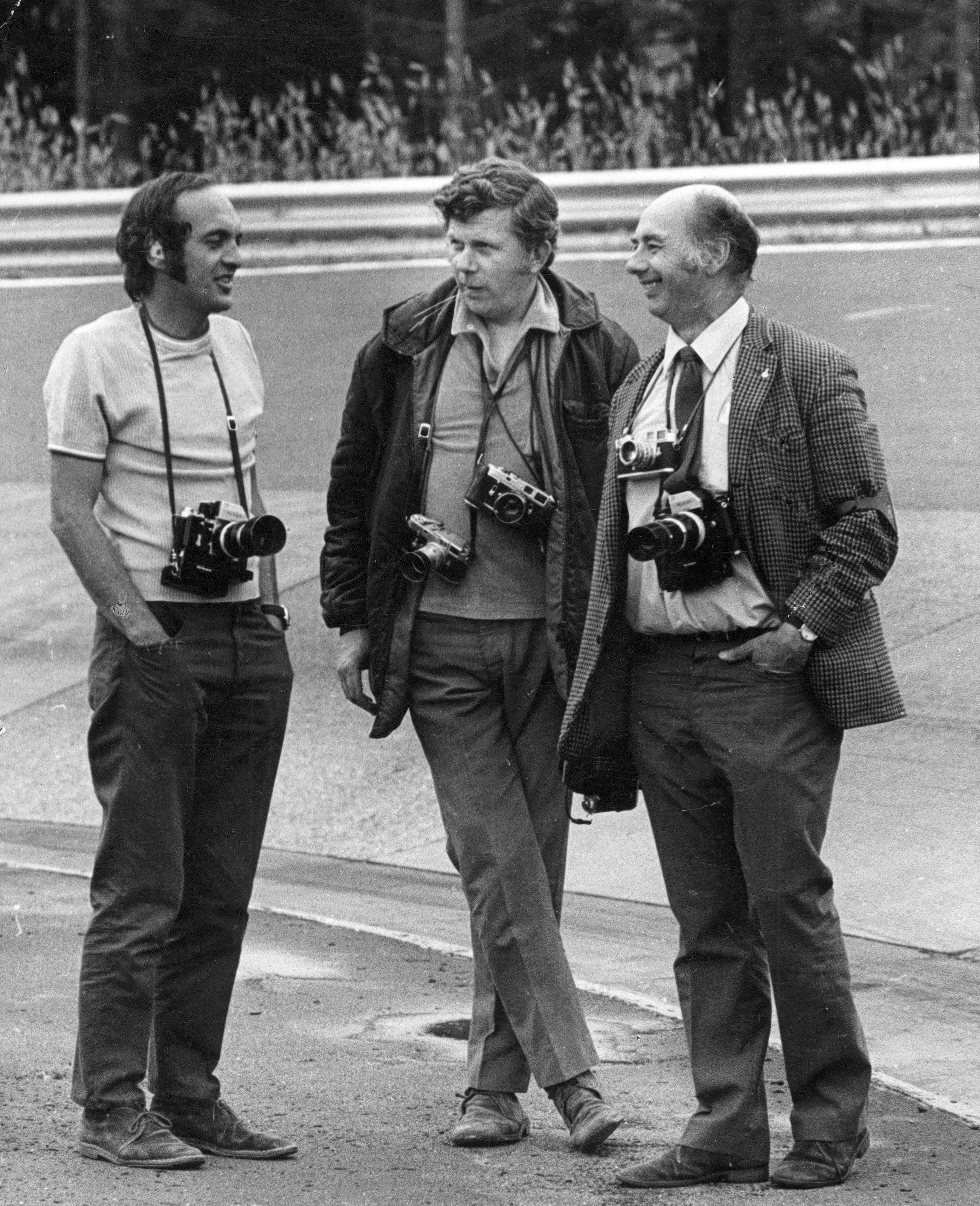 Karussel, Nurburgring - waiting for F1 practice to begin - Maurice Rowe (centre) with fellow photographers Laurie Morton of ‘Motoring News’ and ‘Motor Sport’ (left) and Geoff Goddard of ‘Road & Track’ right