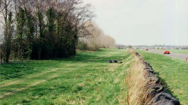 Spectator area between Madgwick and Fordwater - with the eroded old original earth stop bank and its scrap-tyre facing. With the spectator fence set back from the bank all onlookers could see over the barrier was the tops of the driver’s crash helmets going past… Today huge berms raise the viewpoint.