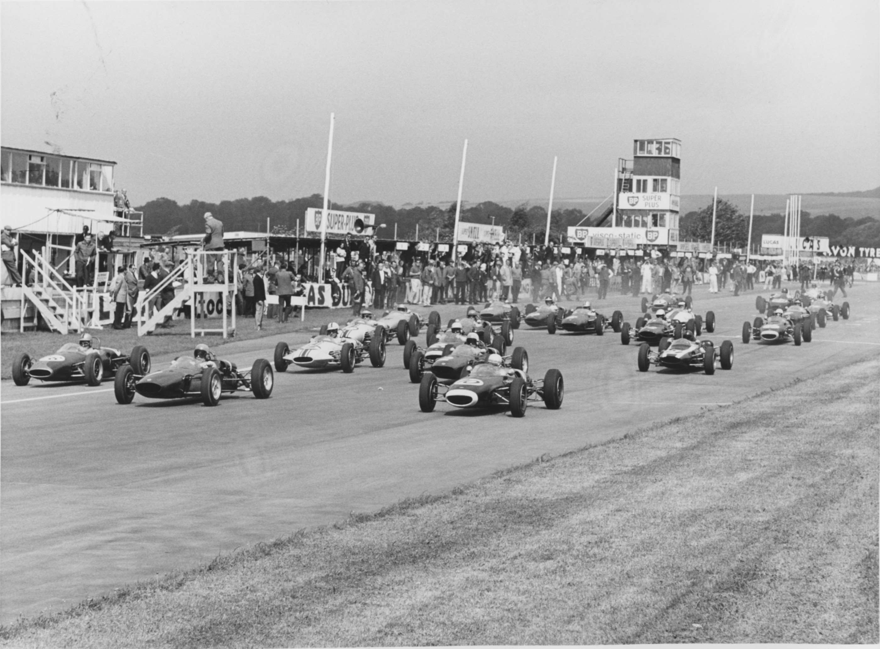 Formula Juniors catapulting off the grid - 1963 - the pit block beyond with its assorted things to fall off...