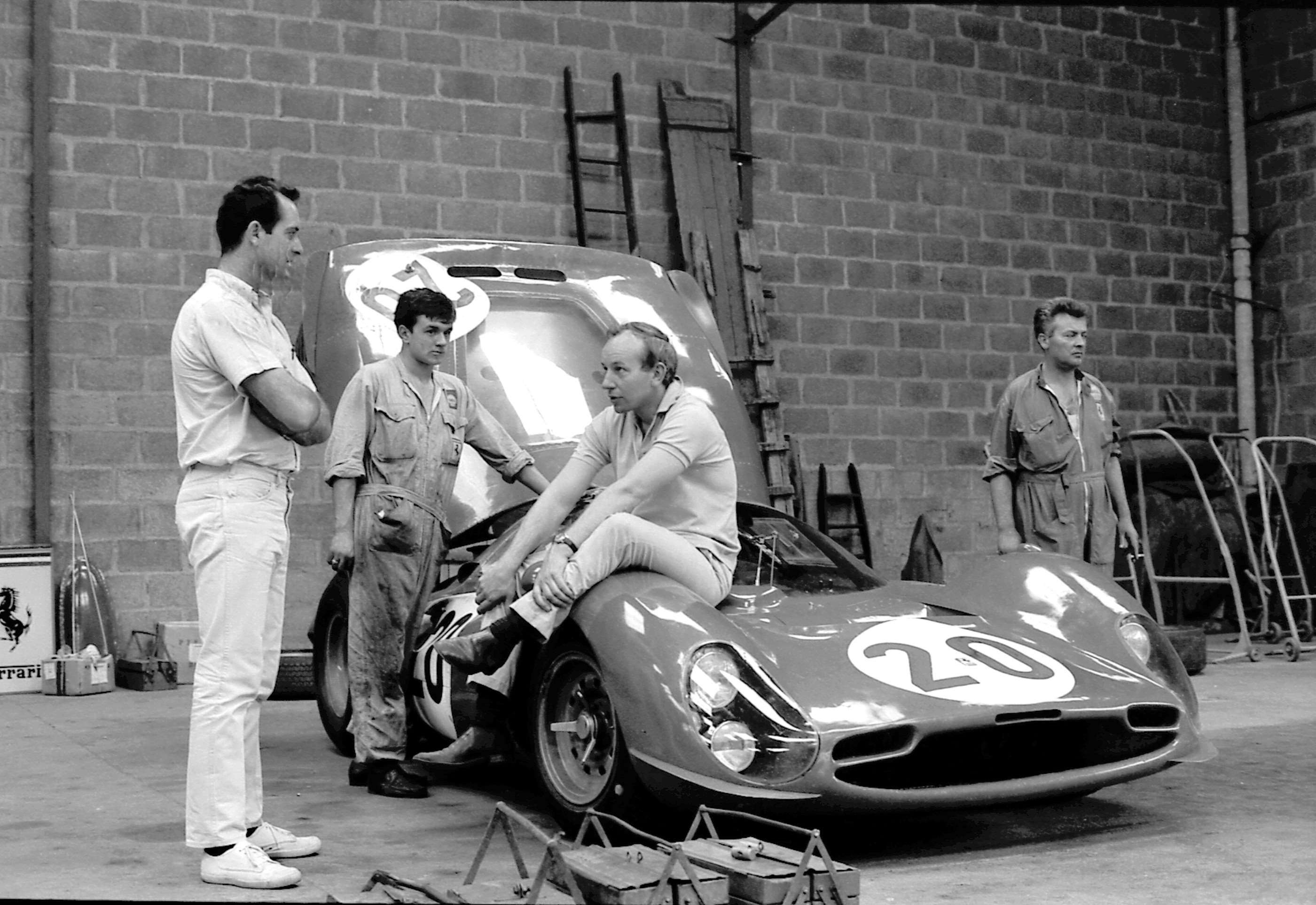 And how much shape might sir require?  John Surtees draped over the Ferrari 330P3 at Le Mans 1966 - before walking out of the team pre-race.  Bob Bondurant to the left.