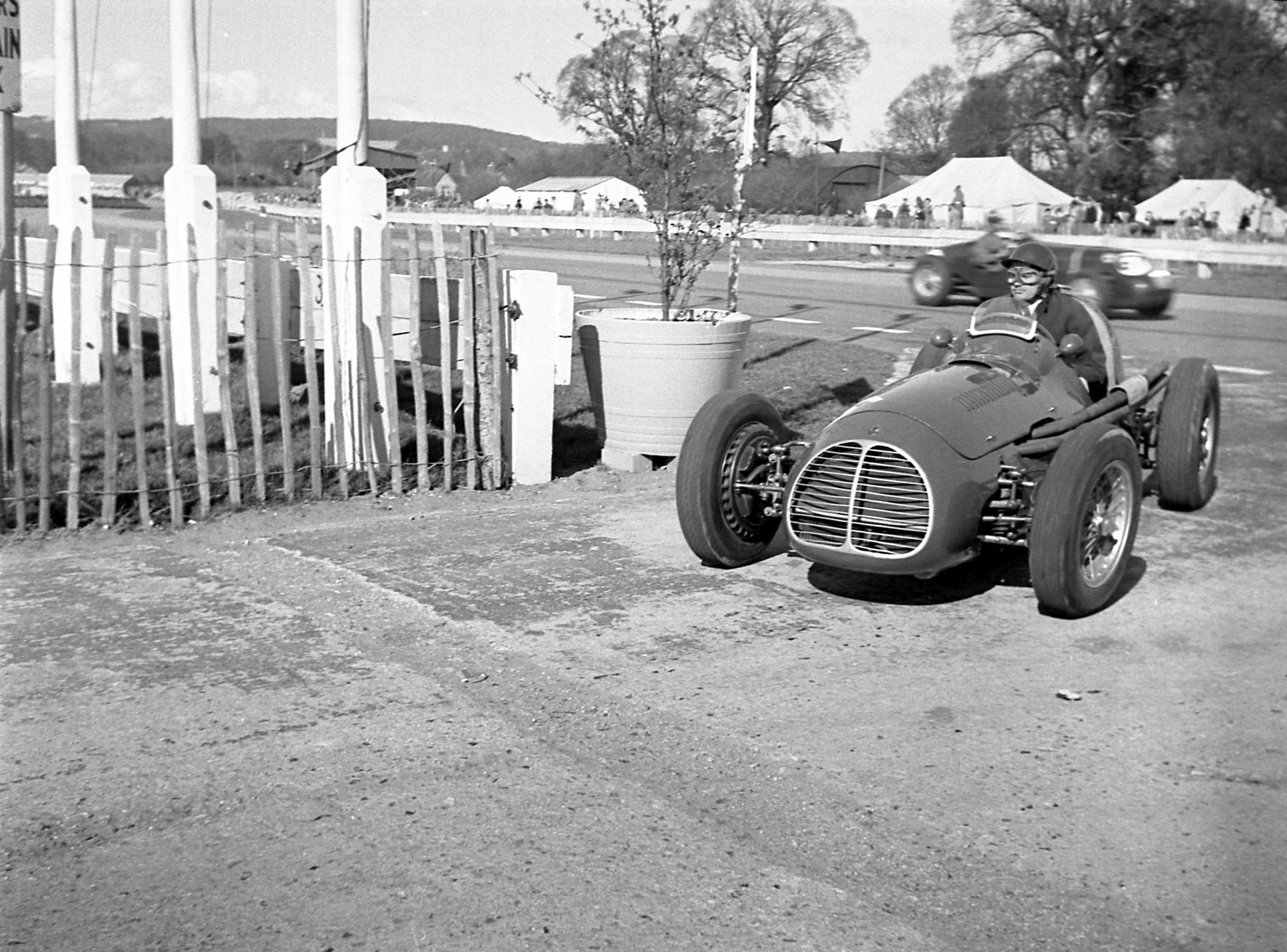 ‘De Graff’ in the Enrico Plate-prepared and run Maserati A6GCM at Goodwood, 1953 - happy chap returning to the paddock