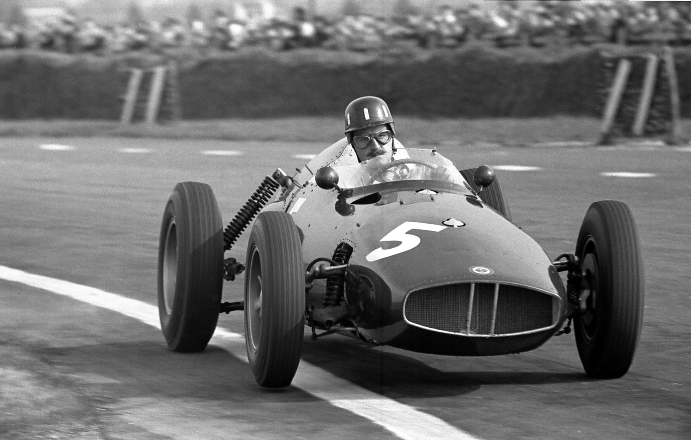 Graham Hill - moustache bristling - at Goodwood on Easter Monday 1959 driving one of the early rear-engined BRM P48 F1 cars