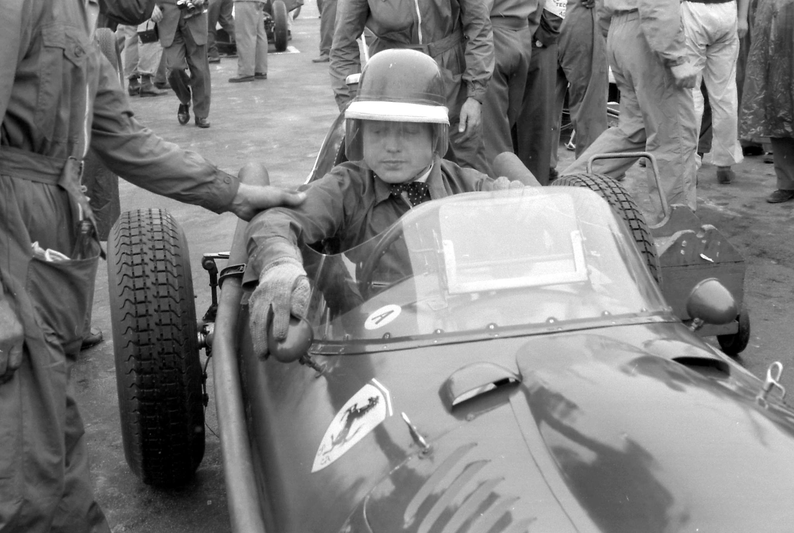 2 - ‘The Farnham Flyer’ carefully adjusting his Ferrari’s rearview mirrors as the clock ticks down to the damp start of the 1958 Portuguese GP