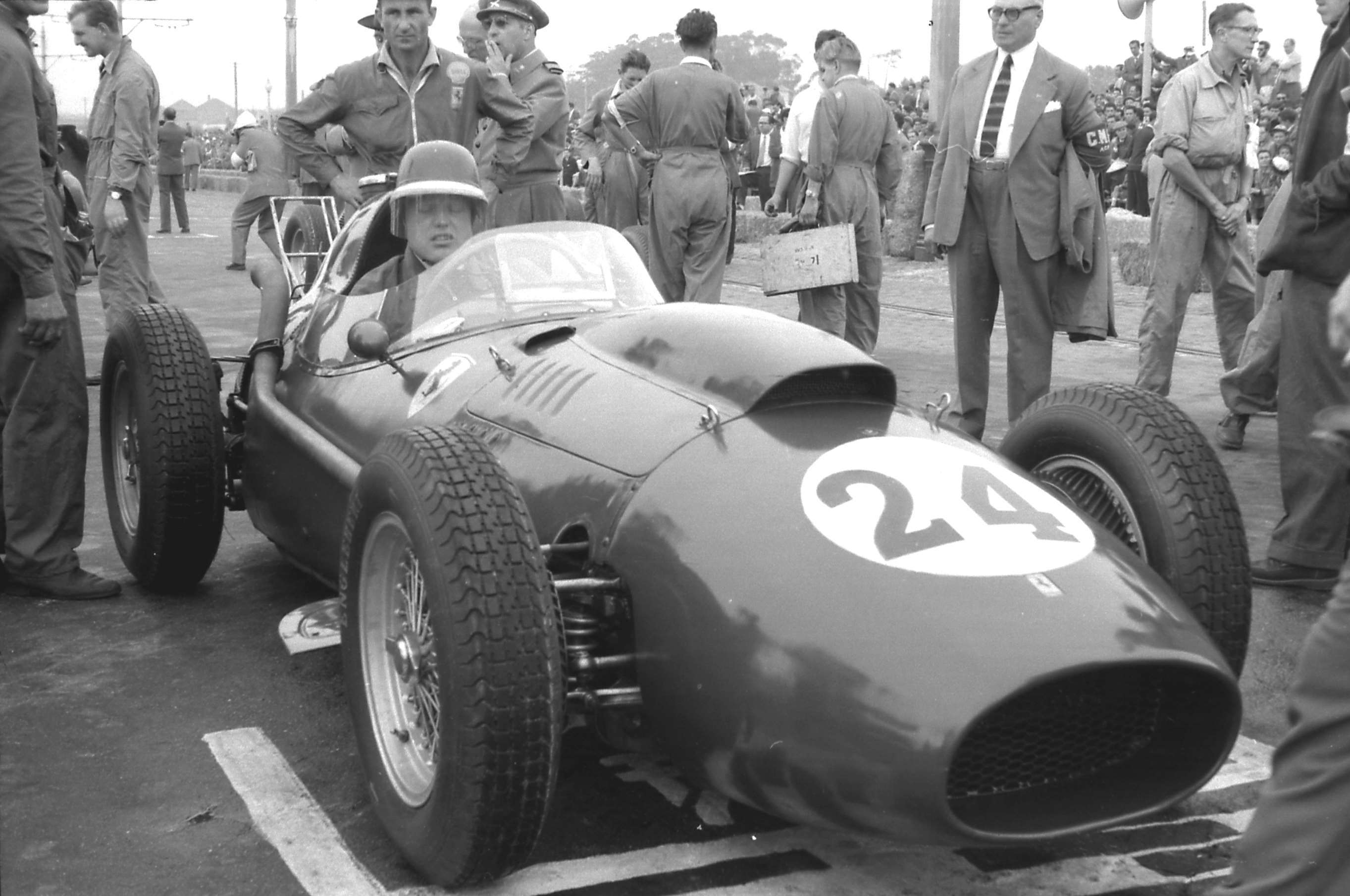 1 - Mike Hawthorn poised in his works Ferrari Dino 246 on the Oporto starting grid - 1958 Portuguese Grand Prix.  The Italian car’s heavily finned drum brakes were its Achilles heel...