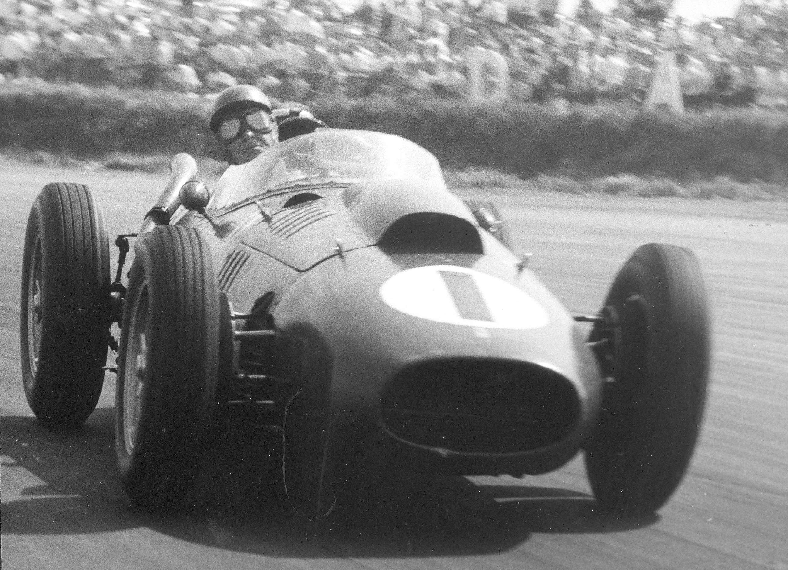 Peter Collins - winner of the 1958 British GP at Silverstone - in full flight on his works Ferrari Dino 246.