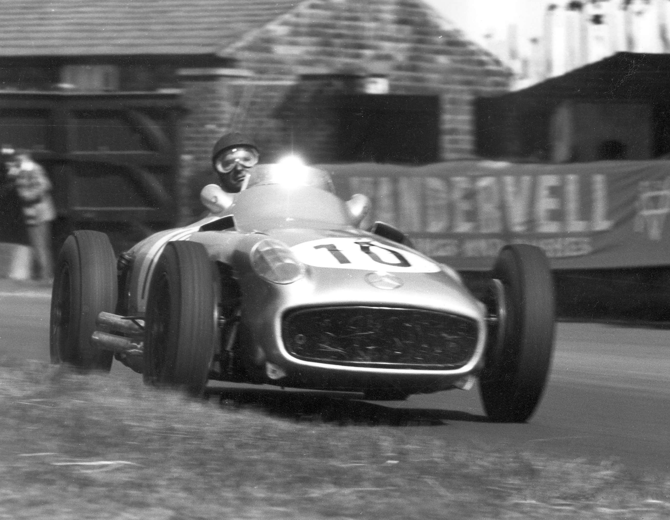 He took his third World Championship title driving solely for Mercedes-Benz in 1955 - here en route to 2nd place (behind team-mate Moss) in the British GP at Aintree; he was truly touched by genius.