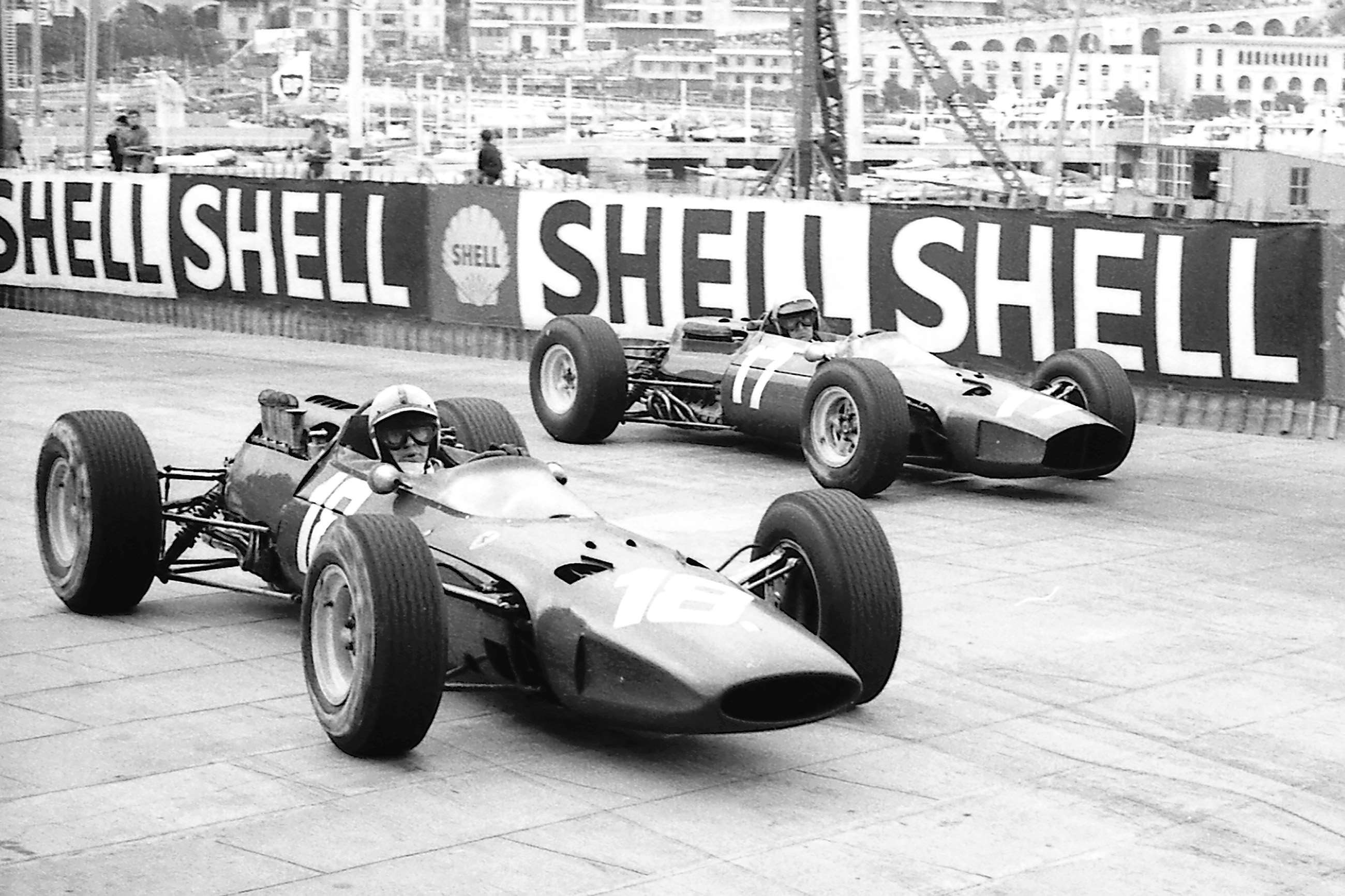 1965 Monaco GP - John Surtees in the V8-engined Ferrari 158 on the tight line into the Gasworks Hairpin - Lorenzo Bandini in the flat-12 Ferrari 1512 outside him