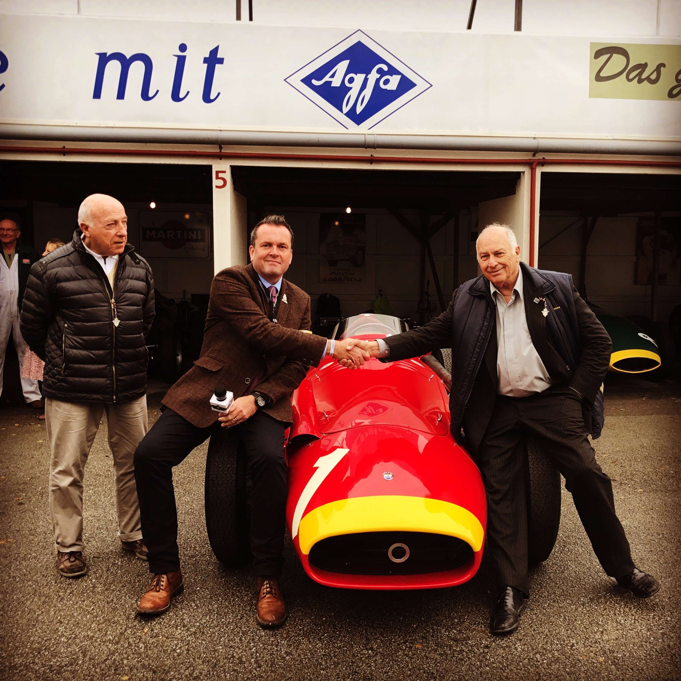 Henry sharing a moment with Fangio's sons - surprise guests at Revival 2017.