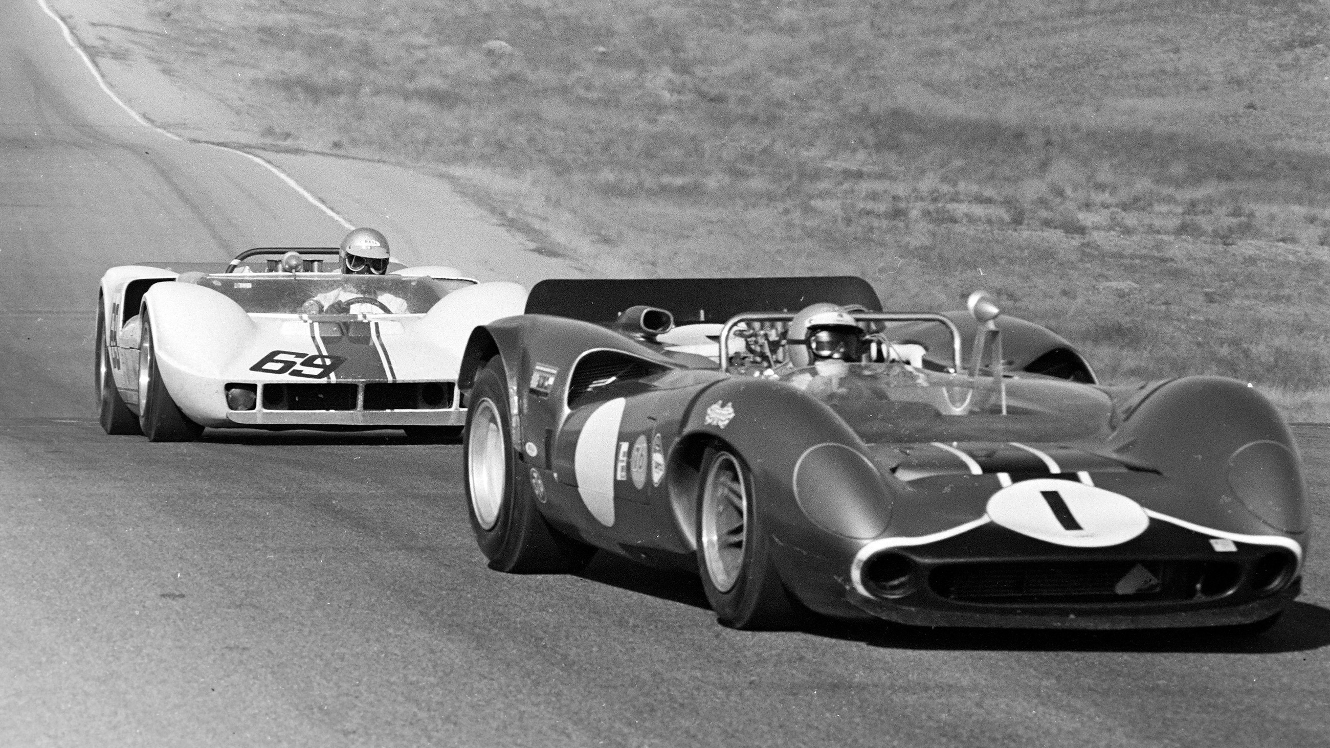 Ed Hamill racing his car #69 against Mario Andretti's Lola T70 at Riverside.