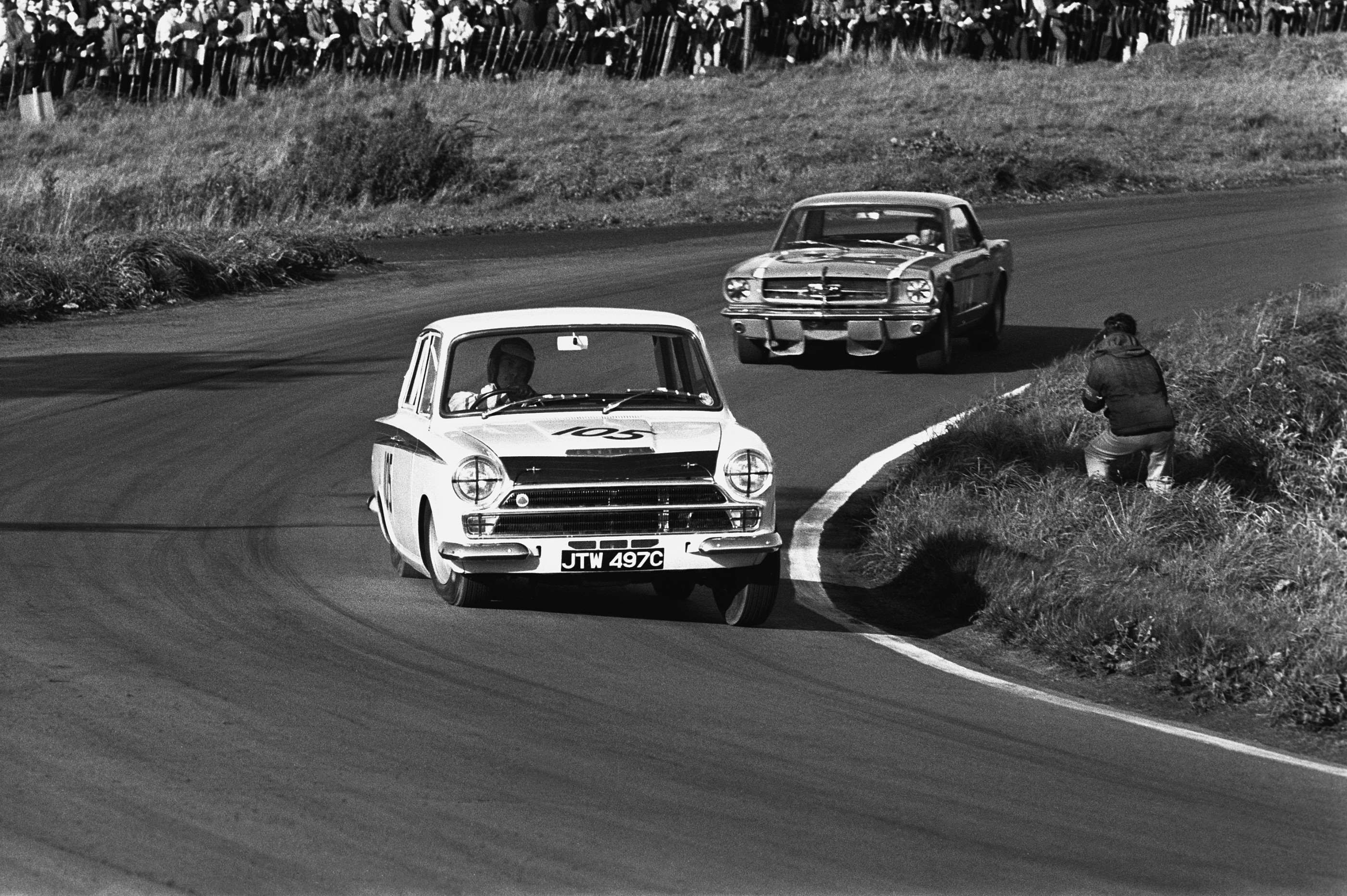 The plucky Cortina (Clark) leads Brabham's Mustang at Oulton, 1965