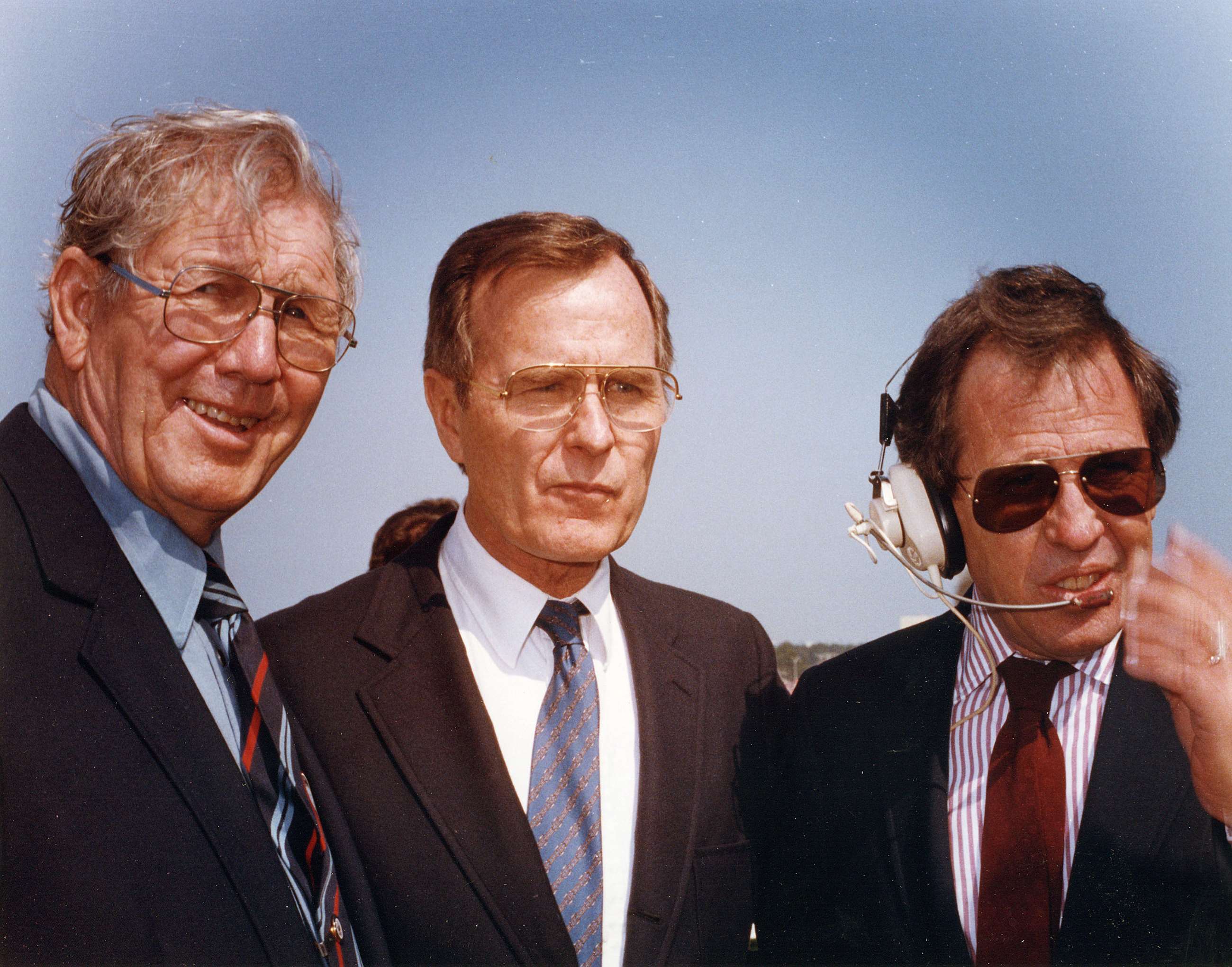 Brian France Sr. (left), George H.W. Bush (centre), Brian France Jr. (right).