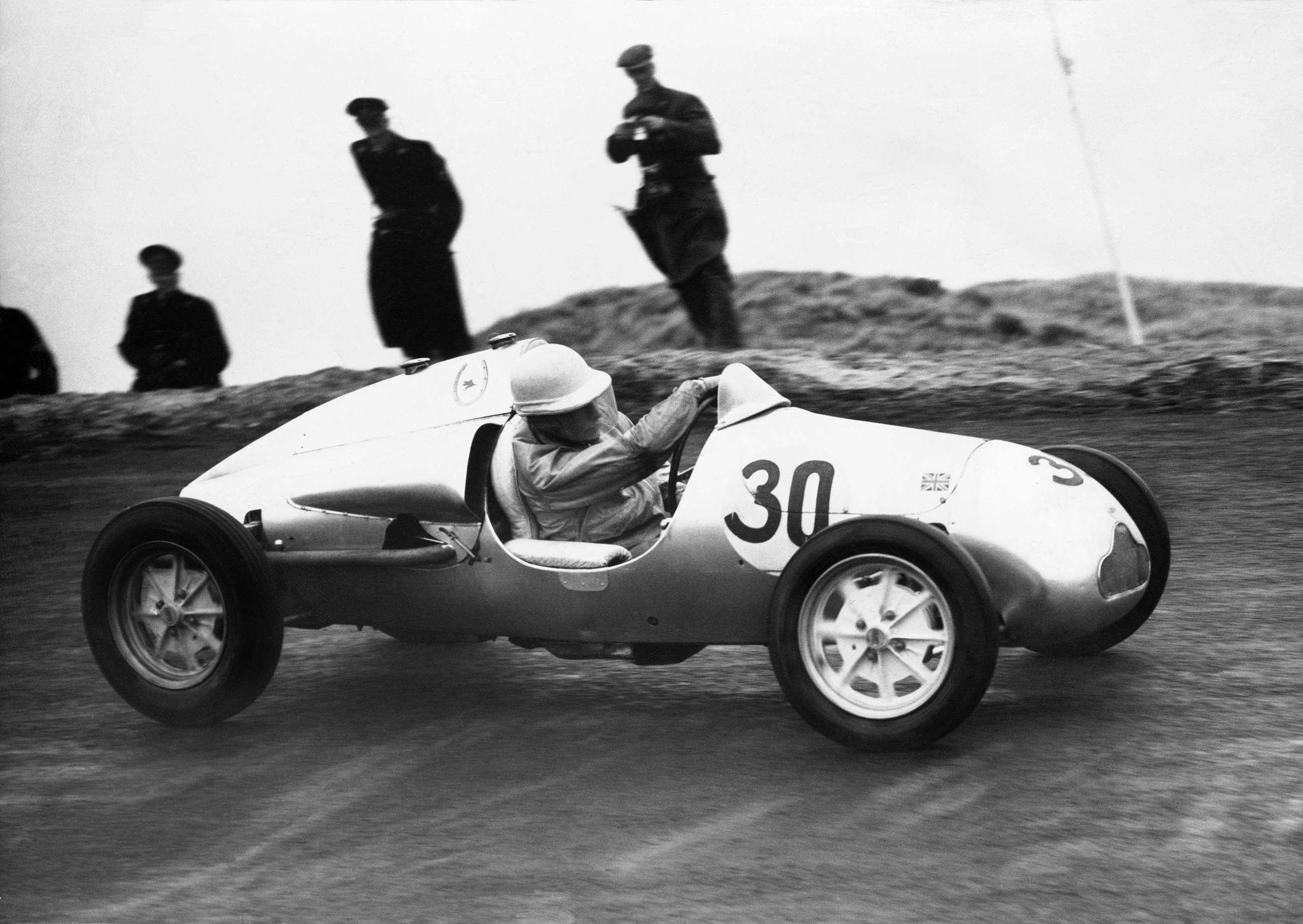 Top, Jack Brabham driving a Cooper T53-Climax in Monaco, 1960. Above, Stirling Moss driving a Cooper-JAP MkIII at Zandvoort, 1949. 
