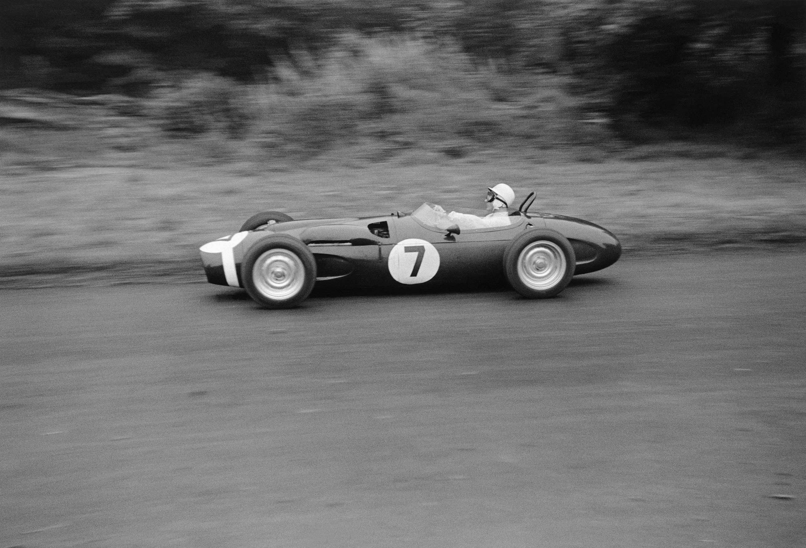Stirling Moss at Oulton Park, 1961, driving the four-wheel-drive Ferguson P99-Climax S4 to victory.