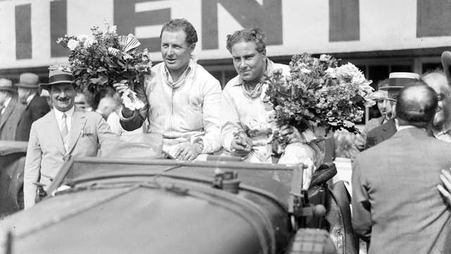 Glen Kidston (left) and Woolf Barnato (right) atop their Bentley Speed Six having just won the 1930 Le Mans 24 Hours.
