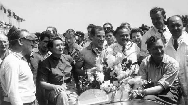 Moss flanked by his mum and dad after victory at Reims, 1953.