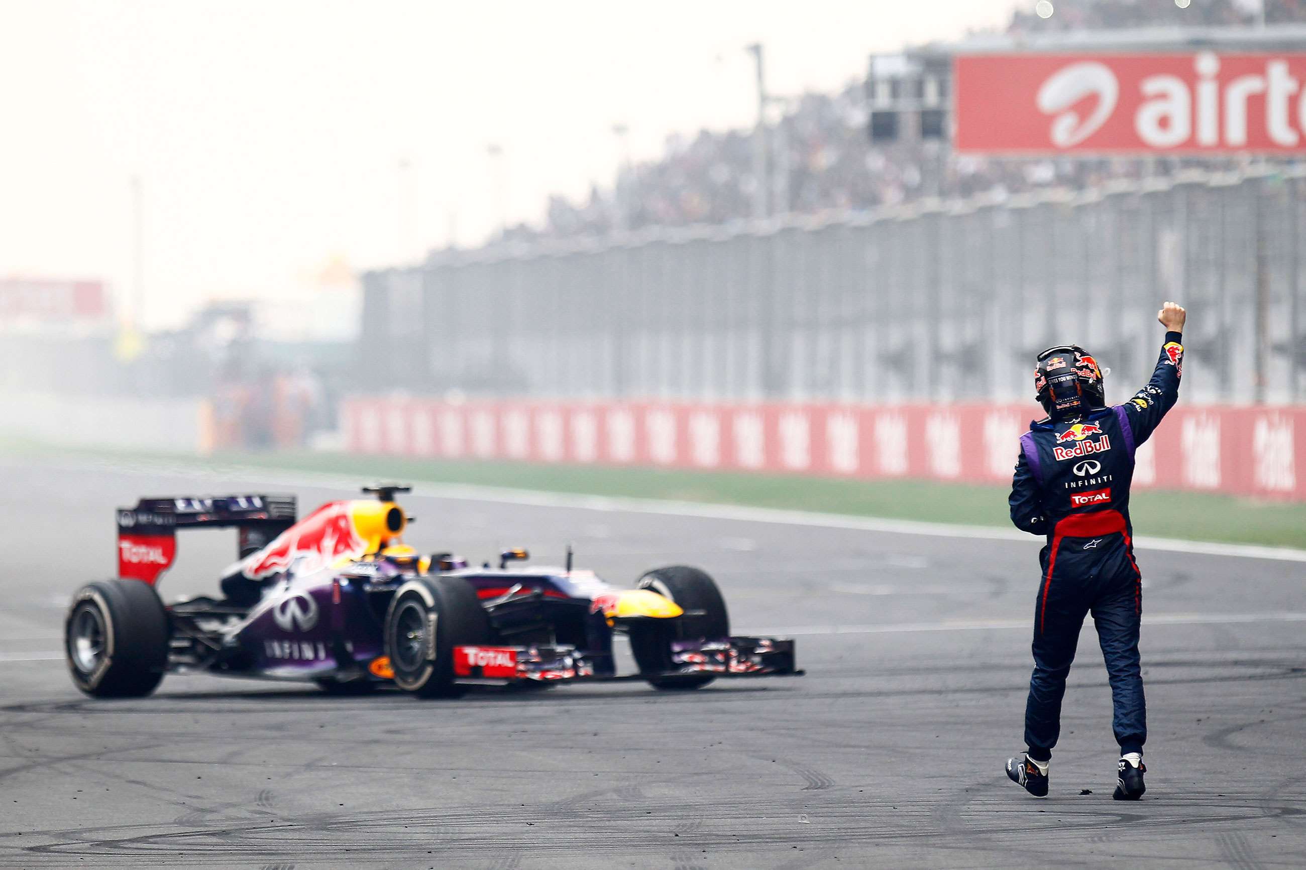 Sebastian Vettel having just won his fourth Formula 1 Drivers' Championship. He wasn't supposed to stop and do doughnuts on the pit straight, let alone get out of his car, but he did both anyway... 
