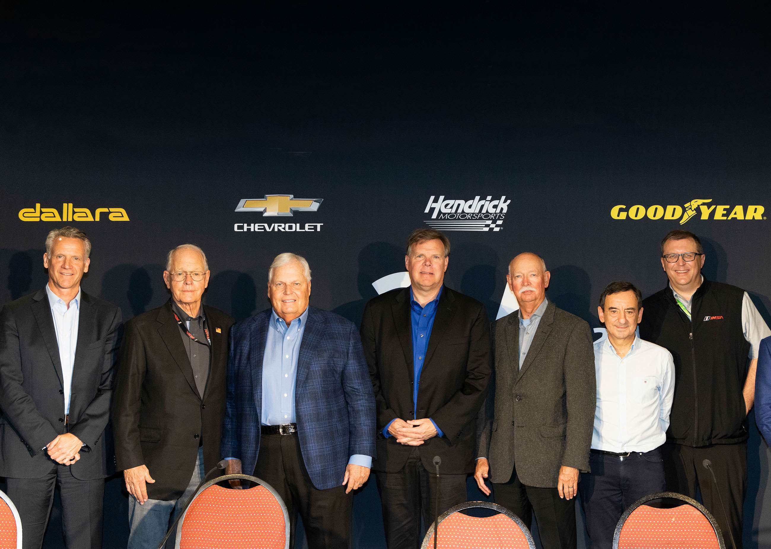 From left to right: NASCAR President Steve Phelps, IMSA and NASCAR CEO Jim France, Rick Hendrick, Jim Campbell of Chevrolet, Stu Grant of Goodyear, ACO President Pierre Fillon, and IMSA President John Doonan.