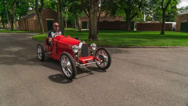 Bugatti test driver and two-time Le Mans winner Andy Wallace at the wheel, holding the Baby II on the ragged edge. 