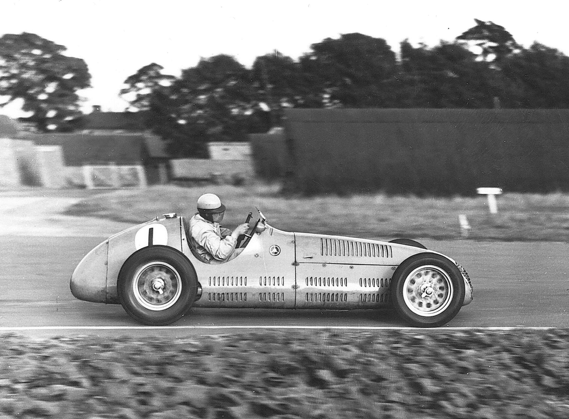 Goodwood’s first star driver - the avuncular Reg Parnell, hard-hatted in his Maserati, 1949