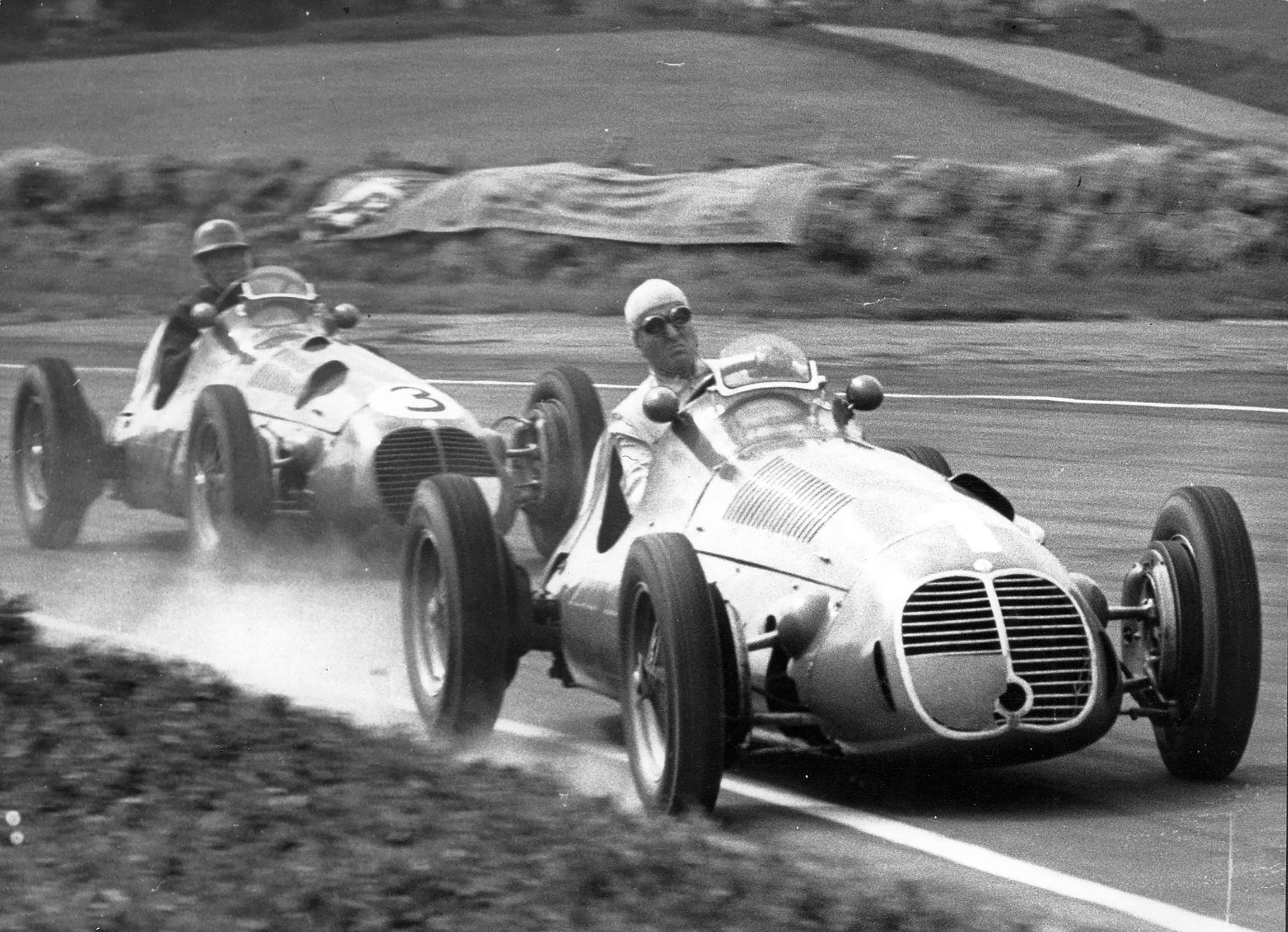 Matching Maseratis but Continental Crack versus local English also-ran - Dr Nino Farina, World Champion, laps David Hampshire at Goodwood, 1951