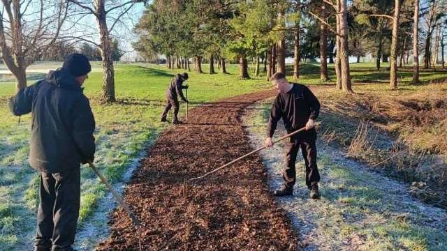 The Team putting to use some wood chip. Creating a tidy path between the back tee and main tee on the 9th and protecting the single trees on the course. Putting woodchip down stops us strimming around or driving near the tree so there is no compaction on the roots or damage to the bark.