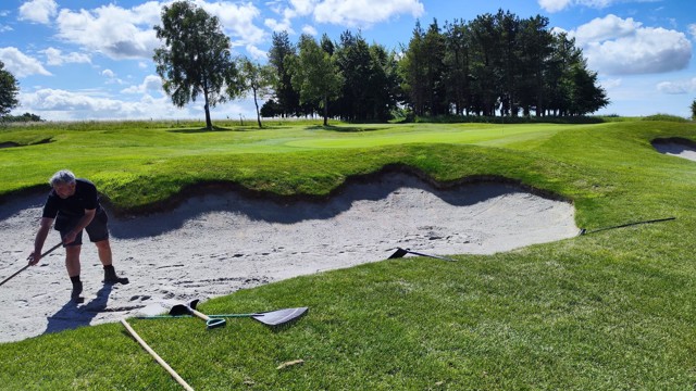 Bunkers being topped up with sand after delay from the quarry