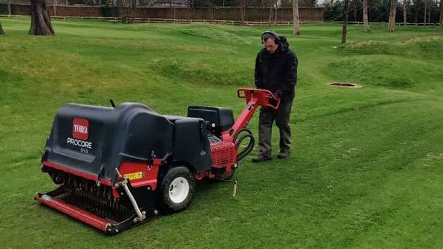Aerating all green surrounds and approaches to enhance root development.