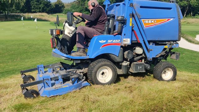 Scott getting to work cutting all the long rough