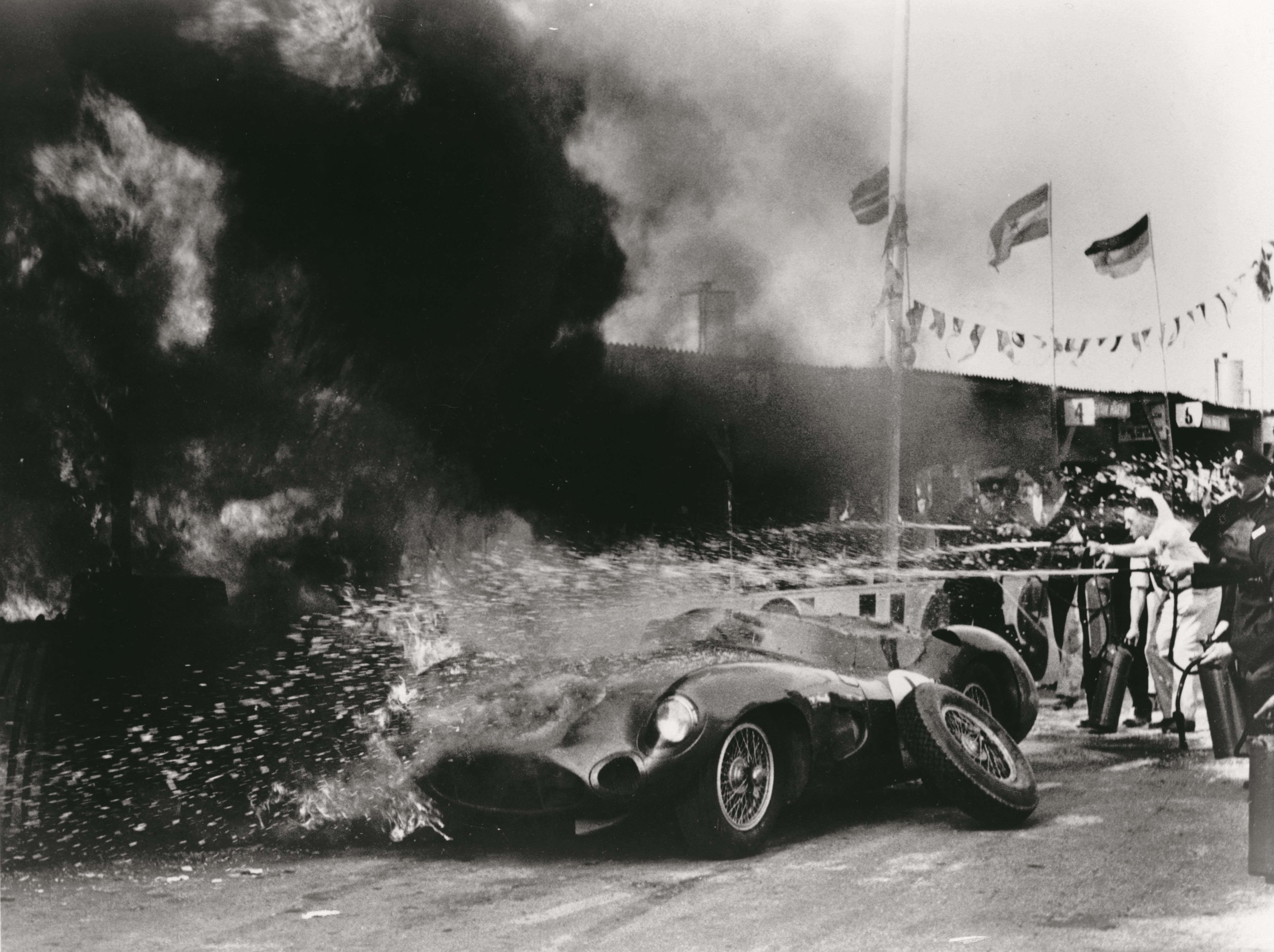 Roy Salvadori’s DBR1 on fire in the pits during the 1959 Tourist Trophy Race at Goodwood.