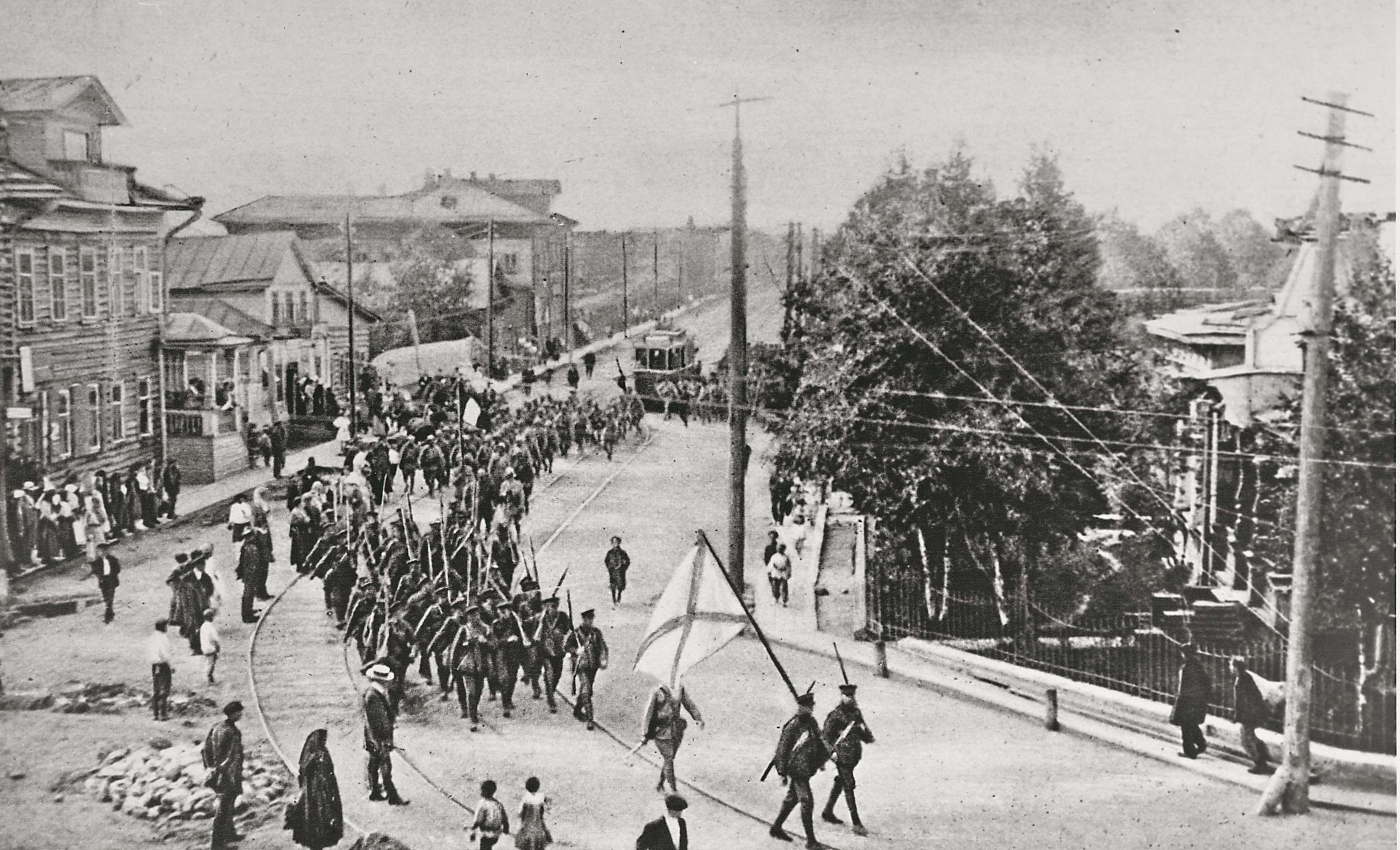 White Russian soldiers march through an occupied city on a recruitment drive to gainmore troops for their fight against the Bolsheviks